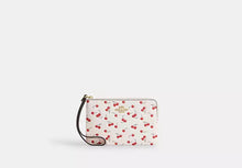 Load image into Gallery viewer, COACH CORNER ZIP WRISTLET WITH CHERRY PRINT IN CHALK MULTI