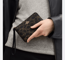 Load image into Gallery viewer, COACH CORNER ZIP WRISTLET IN LOVED SIGNATURE CANVAS (CEF78) IN BROWN
