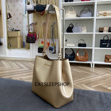 Load image into Gallery viewer, MICHAEL KORS PRATT MEDIUM BUCKET IN PALE GOLD
