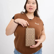 Load image into Gallery viewer, COACH LONG ZIP AROUND WALLET IN SIGNATURE CANVAS IN TAN/BROWN (CW778)
