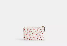 Load image into Gallery viewer, COACH CORNER ZIP WRISTLET WITH CHERRY PRINT IN CHALK MULTI
