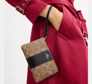COACH CORNER ZIP WRISTLET IN SIGNATURE CANVAS WITH STRIPE (COACH CW854) IN TAN BLACK