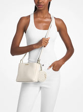 Load image into Gallery viewer, GIFT SET IN LIGHT CREAM : MICHAEL KORS TRISHA MEDIUM LOGO CROSSBODY IN LIGHT CREAM
