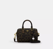 Load image into Gallery viewer, COACH MINI ROWAN CROSSBODY BAG IN LOVED SIGNATURE CANVAS (CDY29 IMBRN) WITH CHARMS IN BROWN

