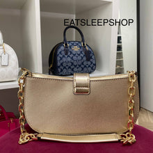 Load image into Gallery viewer, MICHAEL KORS CARMEN SMALL POUCHETTE IN PALE GOLD
