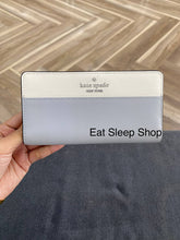 Load image into Gallery viewer, KATE SPADE  LARGE SLIM BIFOLD WALLET MADISON IN PLATINUM (020)

