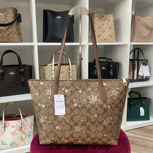 COACH ZIP TOP TOTE IN SIGNATURE CANVAS WITH STAR AND SNOWFLAKE PRINT CN671 IM/KHAKI SADDLE/GOLD MULTI