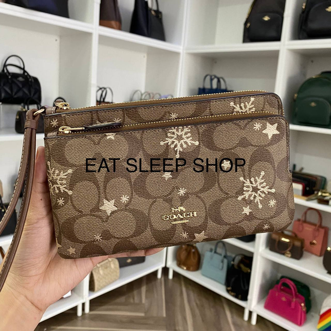 COACH  DOUBLE ZIP WALLET WRISTLET IN SIGNATURE CANVAS WITH STAR AND SNOWFLAKE PRINT CN759 IN KHAKI SADDLE/GOLD MULTI