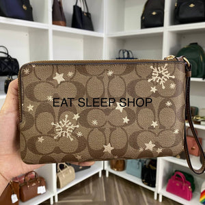 COACH  DOUBLE ZIP WALLET WRISTLET IN SIGNATURE CANVAS WITH STAR AND SNOWFLAKE PRINT CN759 IN KHAKI SADDLE/GOLD MULTI